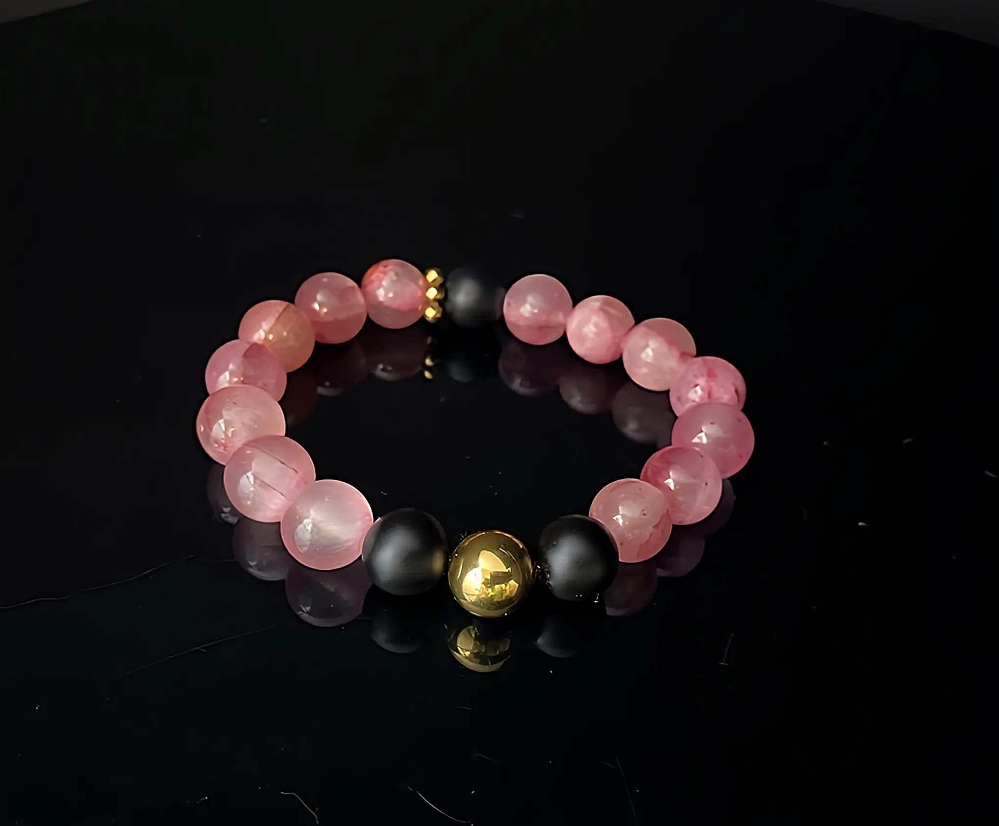 Edelsteinarmband Erdbeerquarz und Onyx