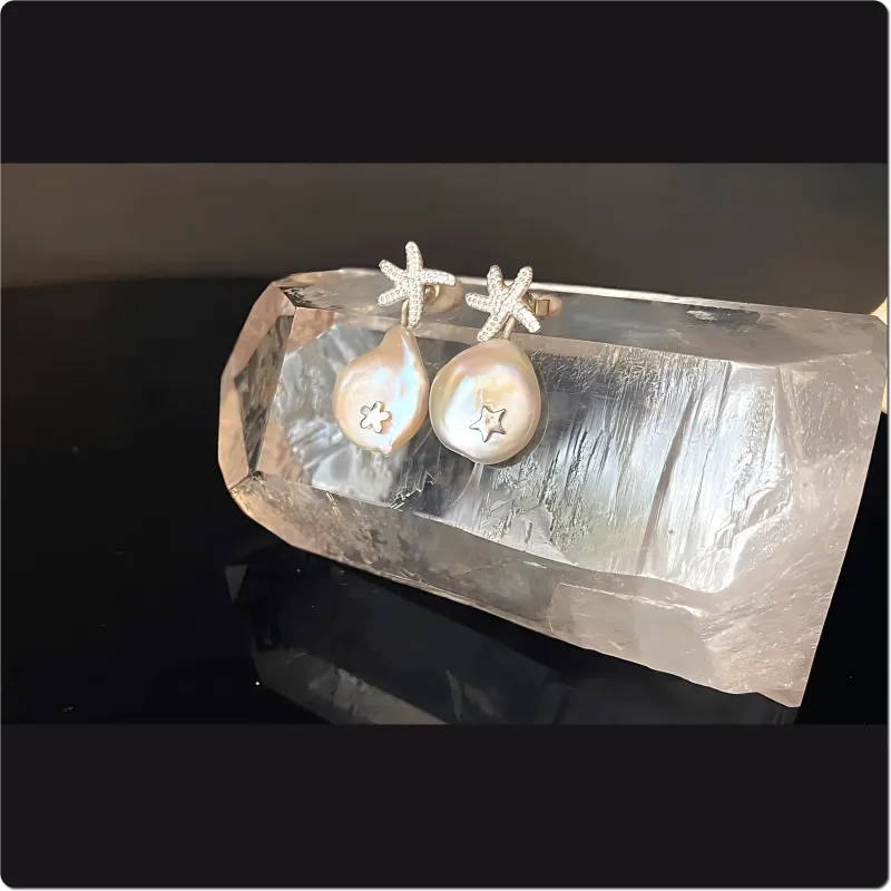 Silberne Seestern-Ohrstecker mit Perle